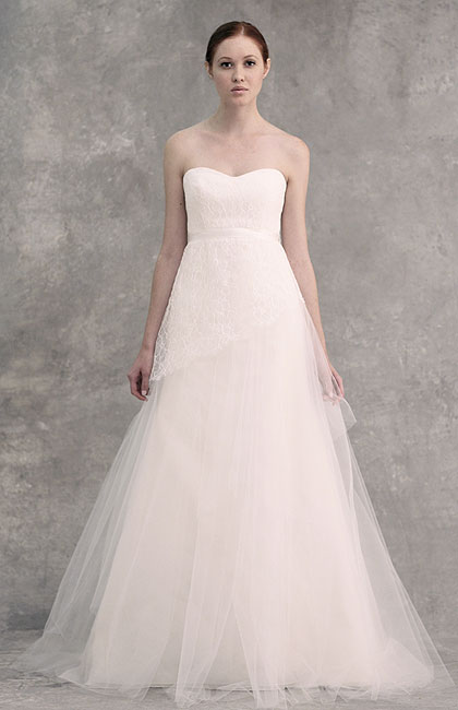  fall asymmetrically along a tiered tulle organza skirt in antique white